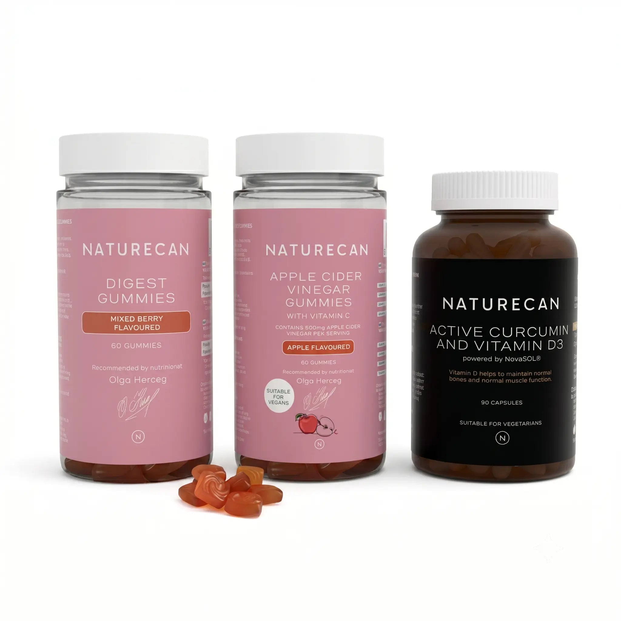 Three bottles of Naturecan supplements, labeled as Digest Gummies, Apple Cider Vinegar Gummies, and Active Curcumin and Vitamin D3, with the gummies visible in one bottle and capsules in another