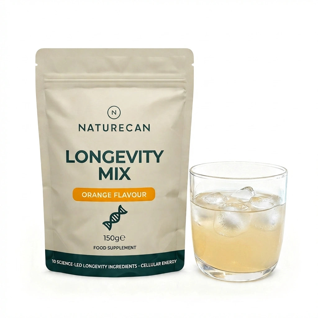 Naturecan Longevity Mix powder pouch beside a glass of mixed orange drink